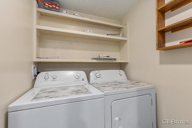 4301 Lasalle Ln, Newaygo, MI 49337 - laundry room featuring washing machine and clothes dryer and a textured ceiling