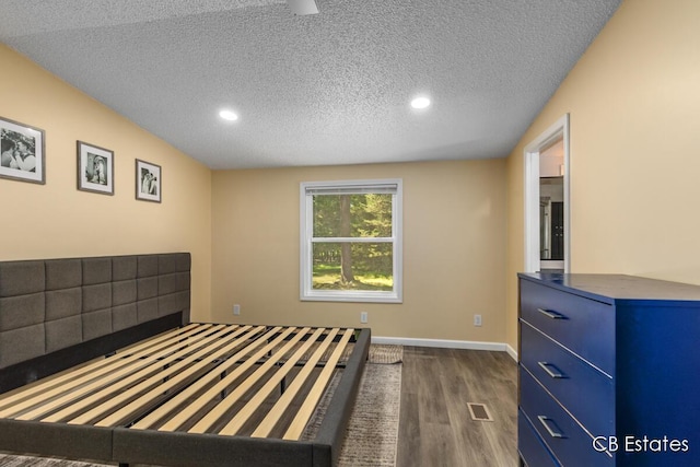 4301 Lasalle Ln, Newaygo, MI 49337 - unfurnished bedroom with dark wood-type flooring, a textured ceiling, and recessed lighting