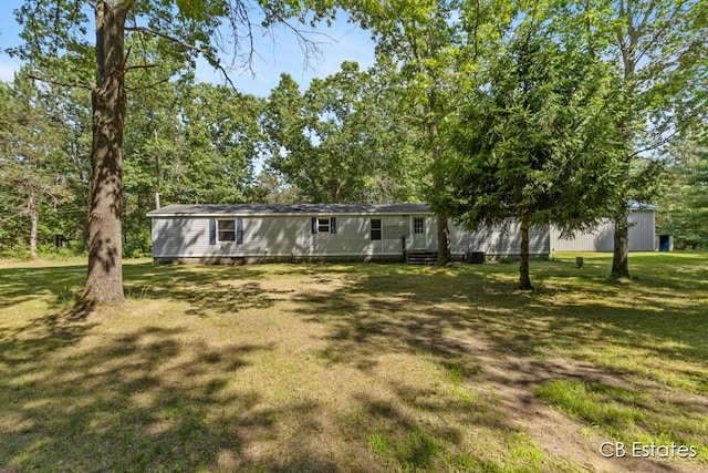 4301 Lasalle Ln, Newaygo, MI 49337 - view of front facade with a front lawn and entry steps