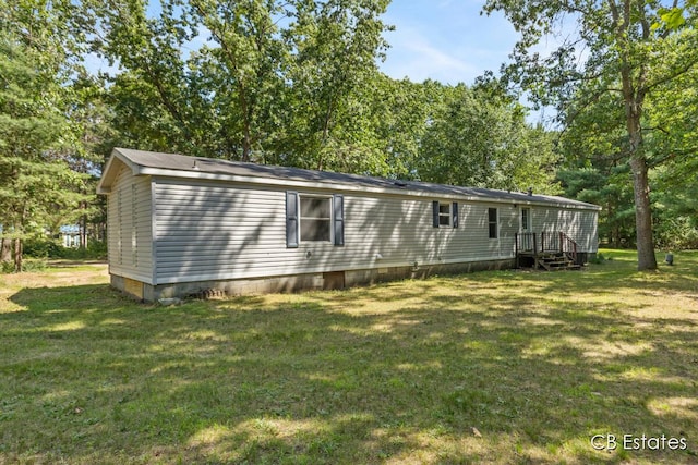 4301 Lasalle Ln, Newaygo, MI 49337 - view of front of house with a front yard, crawl space, and view of wooded area
