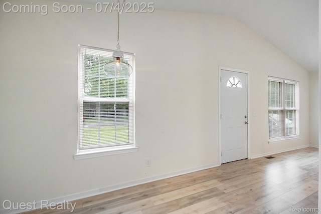 26441 Spicer St, Hazel Park, MI 48071 - foyer featuring healthy amount of natural light, vaulted ceiling, and light wood finished floors