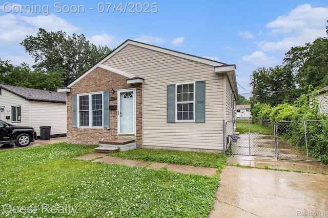 26441 Spicer St, Hazel Park, MI 48071 - bungalow-style home featuring brick siding and a gate