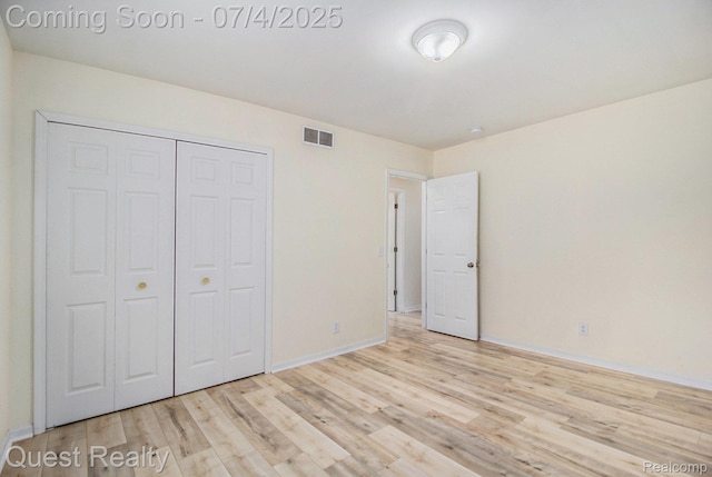 26441 Spicer St, Hazel Park, MI 48071 - unfurnished bedroom with wood finished floors and a closet