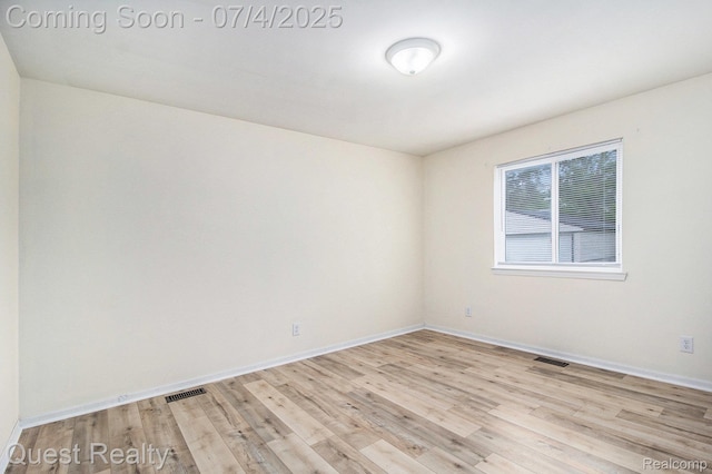 26441 Spicer St, Hazel Park, MI 48071 - spare room featuring wood finished floors and baseboards
