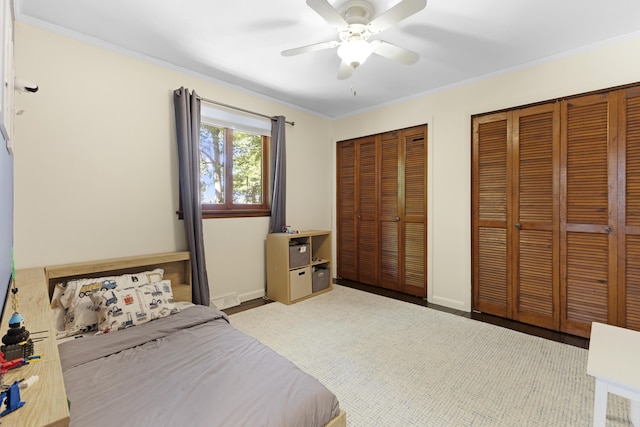 15178 154th Ave, Grand Haven, MI 49417 - bedroom featuring two closets, ornamental molding, ceiling fan, and a baseboard radiator