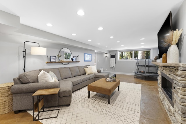 15178 154th Ave, Grand Haven, MI 49417 - living room with recessed lighting, a fireplace, and concrete flooring