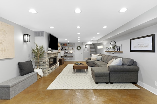 15178 154th Ave, Grand Haven, MI 49417 - living area featuring concrete floors, recessed lighting, stairway, and a stone fireplace
