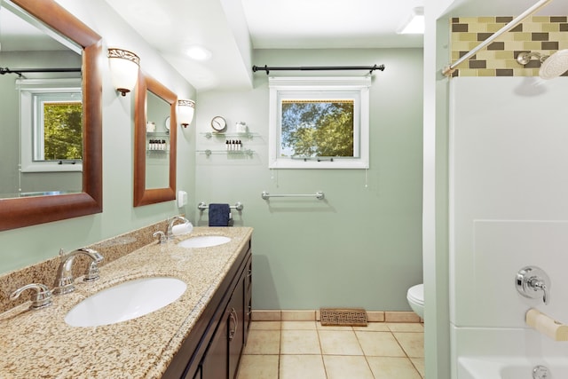 15178 154th Ave, Grand Haven, MI 49417 - bathroom featuring double vanity, healthy amount of natural light, tile patterned flooring, and shower / bath combination