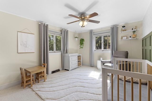 15178 154th Ave, Grand Haven, MI 49417 - bedroom featuring multiple windows, light carpet, and a ceiling fan