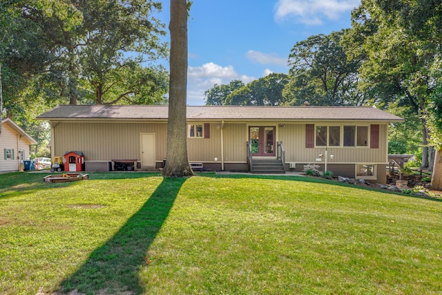 15178 154th Ave, Grand Haven, MI 49417 - view of front facade featuring french doors, a front yard, and entry steps