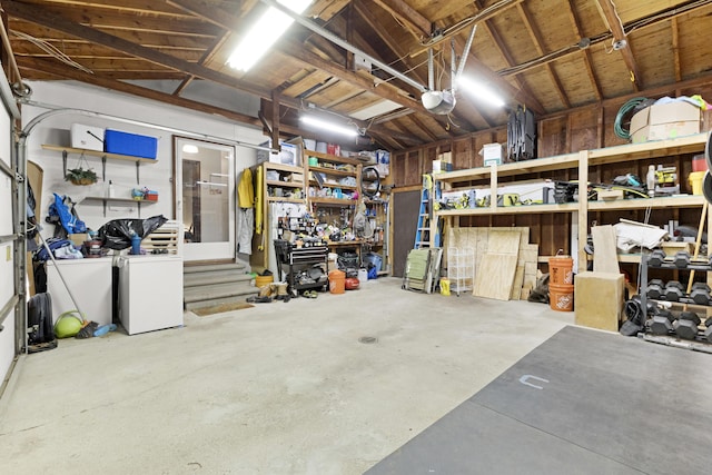 15178 154th Ave, Grand Haven, MI 49417 - garage with a workshop area and a garage door opener