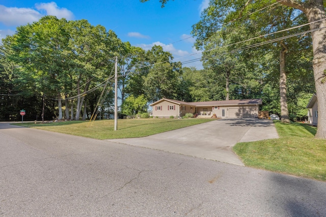 15178 154th Ave, Grand Haven, MI 49417 - ranch-style home featuring driveway, a front lawn, and a garage