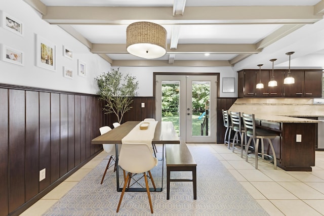 15178 154th Ave, Grand Haven, MI 49417 - dining space with light tile patterned floors, beam ceiling, wainscoting, french doors, and wooden walls