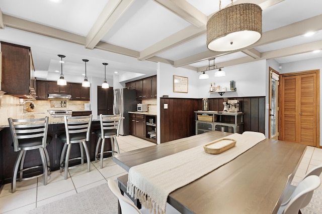15178 154th Ave, Grand Haven, MI 49417 - dining room with light tile patterned flooring, beam ceiling, recessed lighting, and wainscoting
