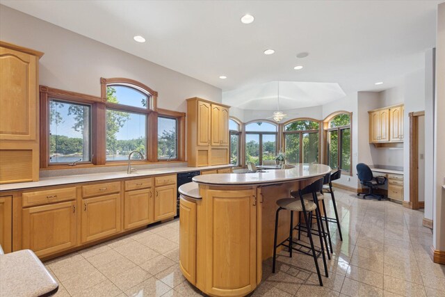 6076 Browns Lake Rd, Jackson, MI 49203 - kitchen with granite floors, healthy amount of natural light, a breakfast bar area, and recessed lighting