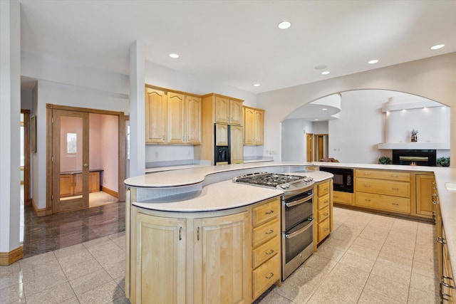 6076 Browns Lake Rd, Jackson, MI 49203 - kitchen with double oven range, light brown cabinets, black microwave, refrigerator with ice dispenser, and recessed lighting