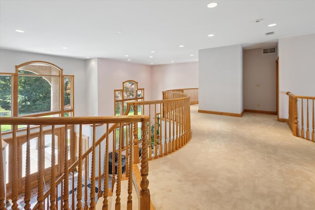 6076 Browns Lake Rd, Jackson, MI 49203 - corridor with light colored carpet, recessed lighting, and an upstairs landing