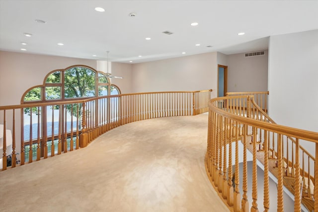 6076 Browns Lake Rd, Jackson, MI 49203 - hall featuring light carpet, recessed lighting, and an upstairs landing