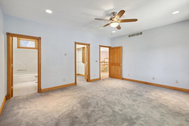 6076 Browns Lake Rd, Jackson, MI 49203 - unfurnished bedroom with a spacious closet, carpet flooring, recessed lighting, ceiling fan, and ensuite bathroom