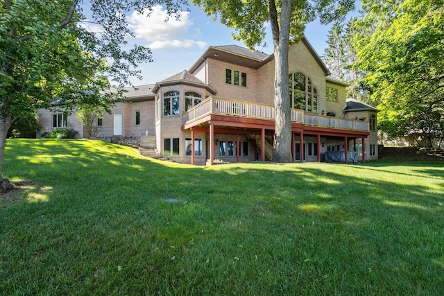 6076 Browns Lake Rd, Jackson, MI 49203 - back of house with a yard, a wooden deck, and brick siding