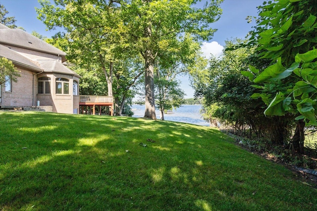 6076 Browns Lake Rd, Jackson, MI 49203 - view of grassy yard featuring a deck with water view