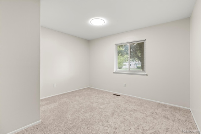 42078 Arthur St, Belleville, MI 48111 - empty room featuring carpet flooring and baseboards