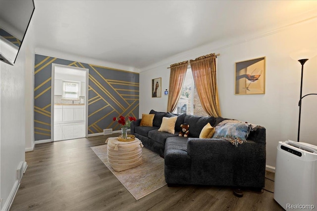 18247 Harlow St, Detroit, MI 48235 - living area featuring wallpapered walls, healthy amount of natural light, wood finished floors, crown molding, and an accent wall