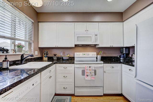 323 W Lincoln Ave, Royal Oak, MI 48067 - kitchen with white appliances, white cabinetry, and light wood-type flooring