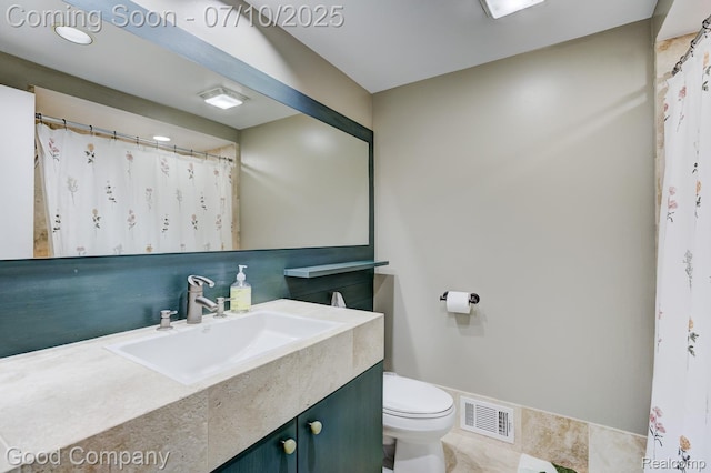 323 W Lincoln Ave, Royal Oak, MI 48067 - bathroom with toilet and vanity