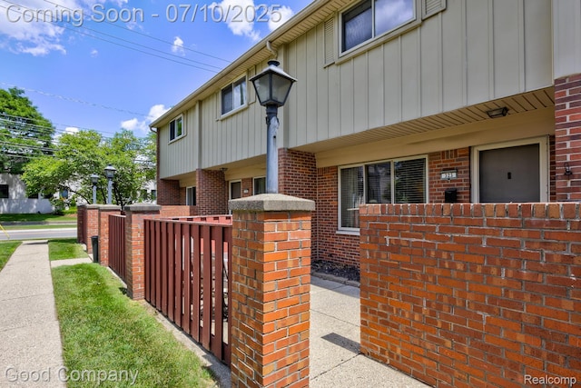 323 W Lincoln Ave, Royal Oak, MI 48067 - view of property exterior featuring board and batten siding and brick siding