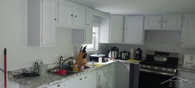 142 W Mason Rd, Twining, MI 48766 - kitchen with electric range and white cabinetry