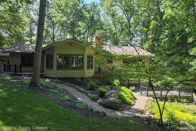 7500 Deerhill Dr, Clarkston, MI 48346 - view of side of home with a chimney and a yard
