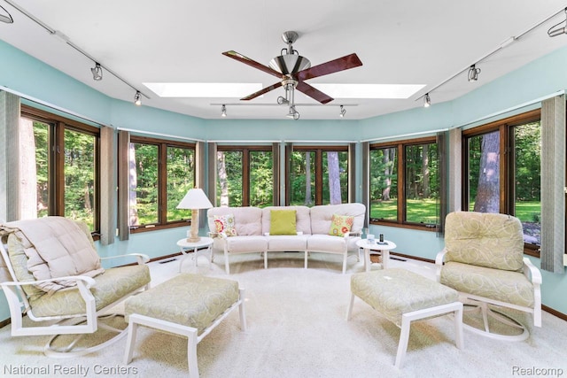 7500 Deerhill Dr, Clarkston, MI 48346 - living room featuring track lighting, a skylight, and plenty of natural light