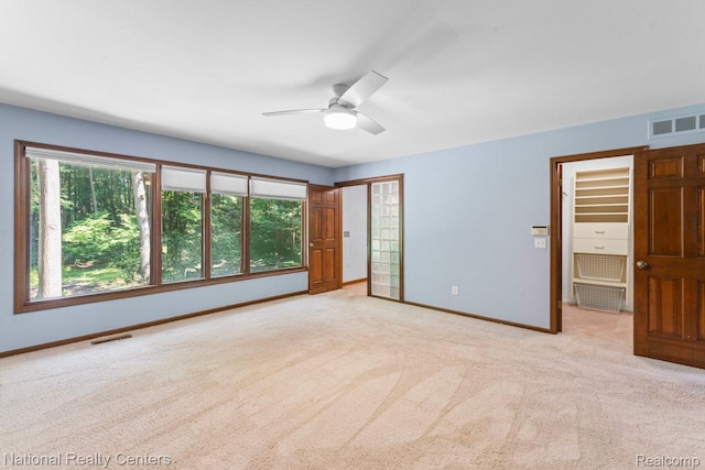 7500 Deerhill Dr, Clarkston, MI 48346 - unfurnished bedroom featuring carpet flooring, a closet, and a ceiling fan