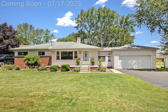 22950 Koths St, Taylor, MI 48180 - view of front of home featuring a chimney, an attached garage, driveway, and a front lawn