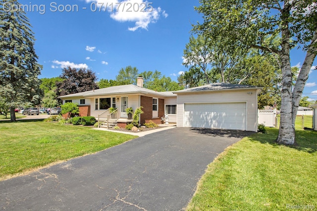 22950 Koths St, Taylor, MI 48180 - single story home with an attached garage, a chimney, driveway, and brick siding