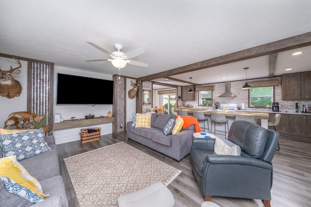 17648 Lost Lake Rd, Barryton, MI 49305 - living area featuring ceiling fan, light wood-style floors, beamed ceiling, and recessed lighting