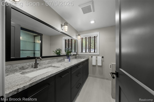 6907 W Knollwood Cir W, Bloomfield, MI 48322 - bathroom with double vanity and baseboards