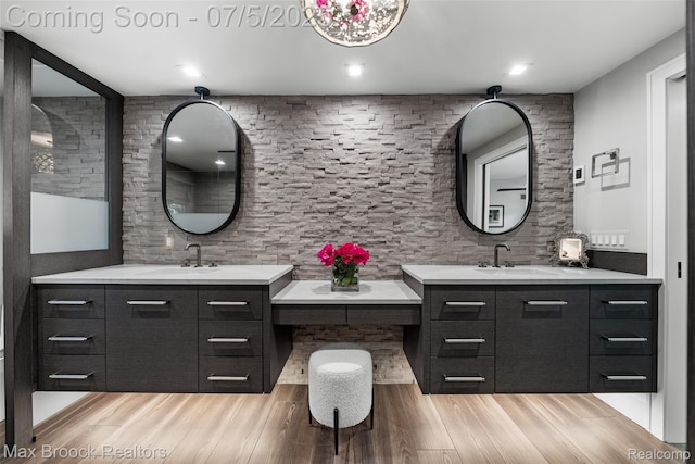 6907 W Knollwood Cir W, Bloomfield, MI 48322 - bathroom featuring two vanities and wood finished floors