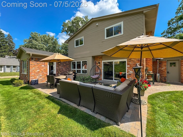 6907 W Knollwood Cir W, Bloomfield, MI 48322 - rear view of property featuring outdoor lounge area, a patio area, a yard, and brick siding