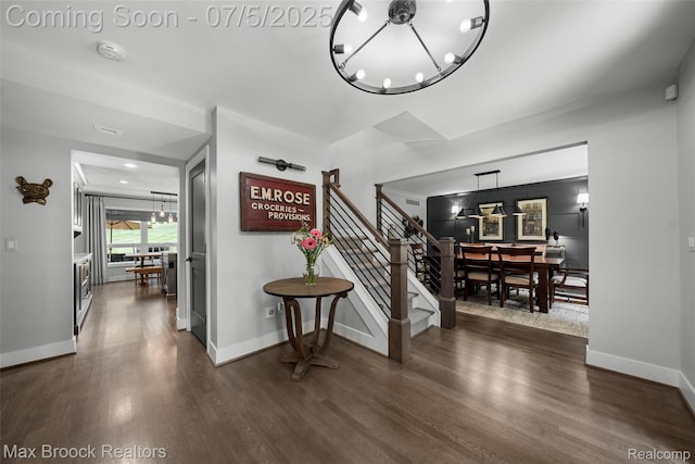 6907 W Knollwood Cir W, Bloomfield, MI 48322 - foyer entrance with a chandelier, dark wood-type flooring, and stairs