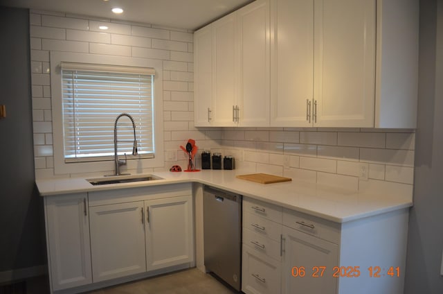 403 Hoover Ave, Benton Harbor, MI 49022 - kitchen featuring dishwasher, tasteful backsplash, white cabinets, and light countertops