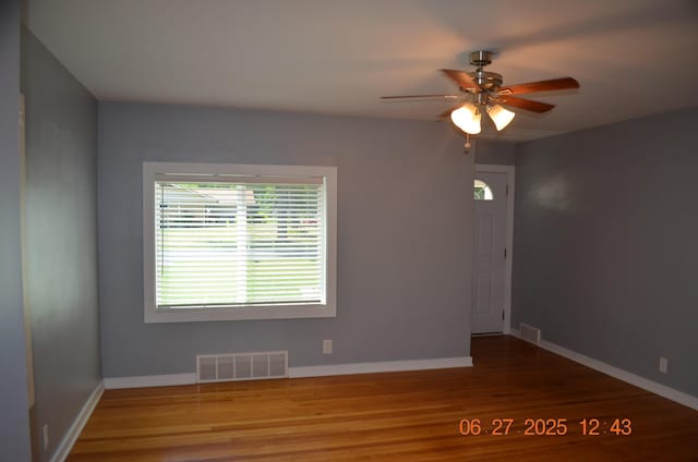 403 Hoover Ave, Benton Harbor, MI 49022 - unfurnished room with wood finished floors and ceiling fan