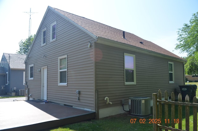 403 Hoover Ave, Benton Harbor, MI 49022 - view of side of home with a cooling unit and a wooden deck