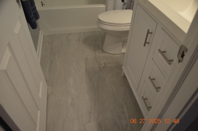 403 Hoover Ave, Benton Harbor, MI 49022 - bathroom with marble look tile flooring, vanity, and a bathtub