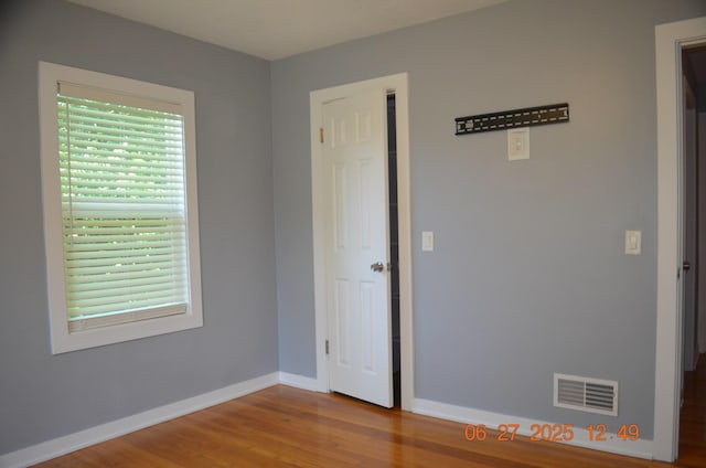 403 Hoover Ave, Benton Harbor, MI 49022 - empty room featuring wood finished floors and baseboards