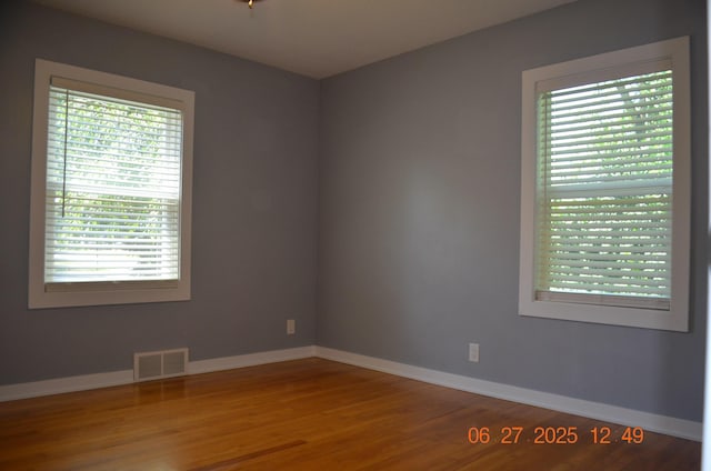 403 Hoover Ave, Benton Harbor, MI 49022 - spare room featuring wood finished floors and baseboards