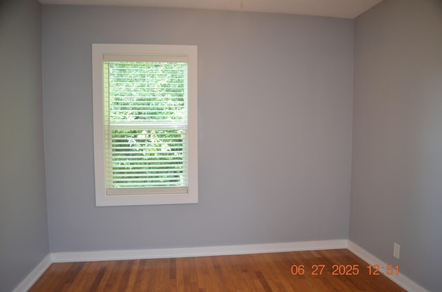 403 Hoover Ave, Benton Harbor, MI 49022 - empty room featuring healthy amount of natural light and wood finished floors