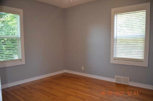 403 Hoover Ave, Benton Harbor, MI 49022 - spare room with wood finished floors and plenty of natural light