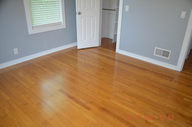 403 Hoover Ave, Benton Harbor, MI 49022 - unfurnished bedroom featuring wood finished floors and a closet